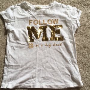 A girls cute follow me shirt